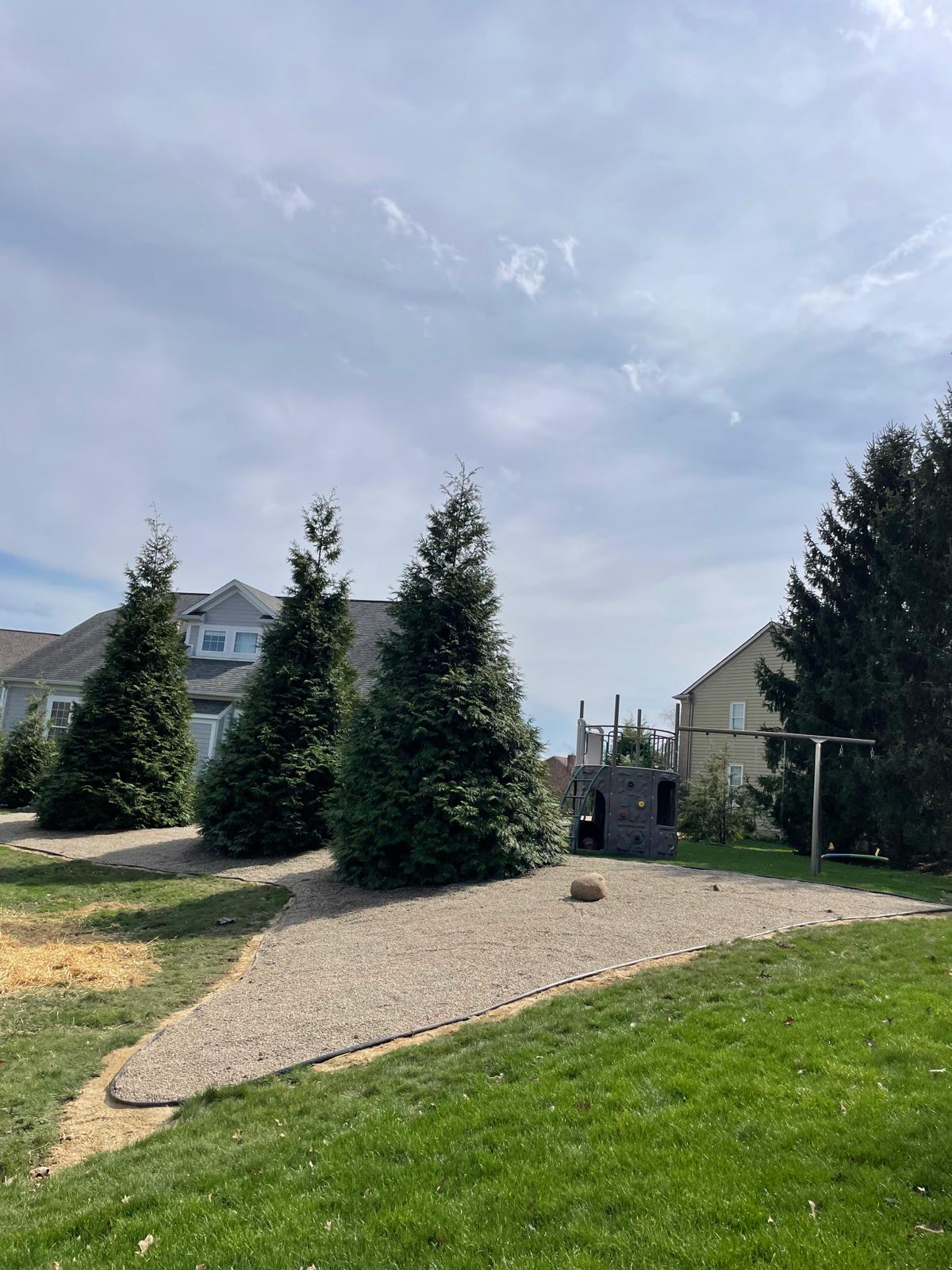 Custom flagstone patio with stone fire pit and retaining wall